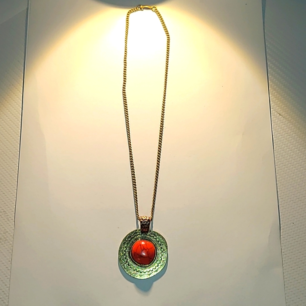 Cool boho coral bead pendant set in brushed gold with brushed gold chain